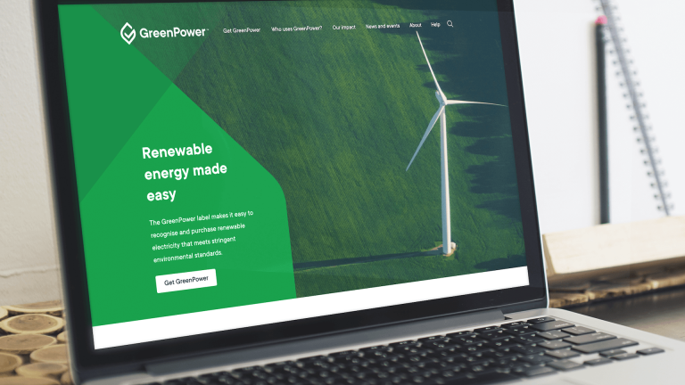 GreenPower homepage shown on a Macbook screen