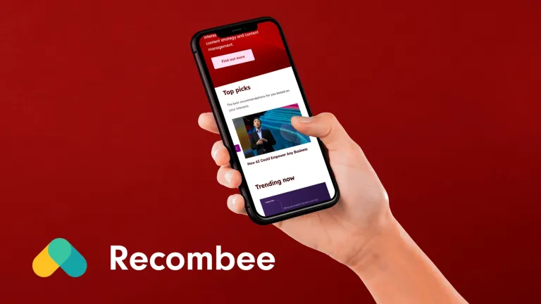 Hand Holding Smart Phone  - GovFlix with Recombee