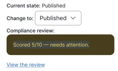 The same status panel after a review, showing an amber compliance review message reading scored 5 out of 10, needs attention, with a View the review link below it