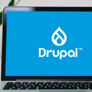 A laptop with Drupal logo